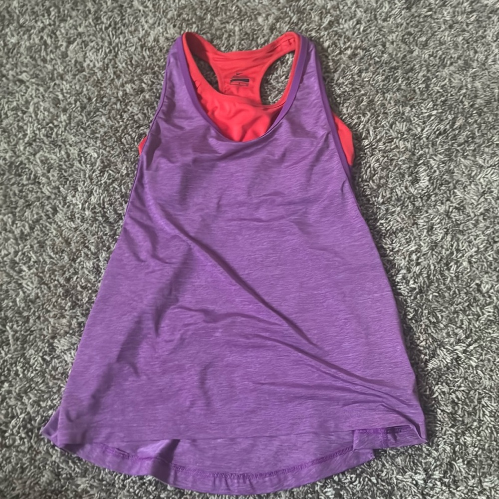 Nike tank top with attached sports bra. No padding. Size small
